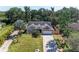Exterior shot of a home with well-maintained lawn, a spacious driveway, and a two-car garage at 2303 58Th E St, Palmetto, FL 34221