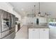 Stylish kitchen with stainless steel appliances, granite counters, and a large island at 2303 58Th E St, Palmetto, FL 34221
