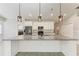 Bright kitchen with granite counters, stainless steel appliances, and modern pendant lighting at 2303 58Th E St, Palmetto, FL 34221