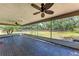 Spacious screened lanai with tiled flooring, ceiling fans, and a view of the backyard at 2303 58Th E St, Palmetto, FL 34221