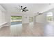 Spacious living room with tile floors, sliding glass doors, and neutral paint at 2303 58Th E St, Palmetto, FL 34221