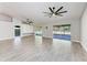 Bright living room with sliding glass doors to a patio, enhanced by modern ceiling fans at 2303 58Th E St, Palmetto, FL 34221