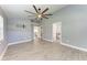 Spacious main bedroom with a modern ceiling fan and an ensuite bathroom at 2303 58Th E St, Palmetto, FL 34221
