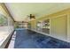 Spacious screened-in patio with brick flooring, ceiling fans, and views of the yard at 2303 58Th E St, Palmetto, FL 34221