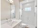 Bathroom features a glass enclosed shower, white subway tile, and modern fixtures at 2319 Webber St, Sarasota, FL 34239