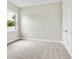 Neutral bedroom with carpet, bright natural light, and base trim at 2319 Webber St, Sarasota, FL 34239