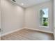 Neutral bedroom with tile flooring, bright natural light, and base trim at 2319 Webber St, Sarasota, FL 34239