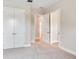 Bright bedroom features a carpeted floor, closet and entry doors, and neutral paint at 2319 Webber St, Sarasota, FL 34239