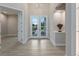 Inviting foyer with modern lighting, stylish flooring, and elegant decor leading into a home's living spaces at 2319 Webber St, Sarasota, FL 34239