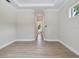 Neutral hallway with tile flooring and view to the bathroom at 2319 Webber St, Sarasota, FL 34239