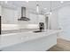 Kitchen featuring a large island with quartz countertops, stainless steel appliances and pendant lighting at 2319 Webber St, Sarasota, FL 34239