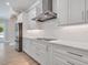 Modern kitchen featuring stainless steel appliances, white cabinets, and subway tile backsplash at 2319 Webber St, Sarasota, FL 34239