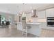 Bright, modern kitchen featuring stainless steel appliances, a large island, and stylish bar seating at 2319 Webber St, Sarasota, FL 34239