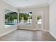 Sunlit living room with large windows overlooking the screened pool area at 2319 Webber St, Sarasota, FL 34239
