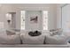 Cozy living room with stylish decor, built-in display cases, and comfortable seating perfect for relaxation at 2319 Webber St, Sarasota, FL 34239