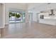 Open floor plan living room with kitchen and large glass doors leading to the pool at 2319 Webber St, Sarasota, FL 34239