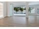 Spacious living area with tile flooring and sliding glass doors to the backyard pool at 2319 Webber St, Sarasota, FL 34239