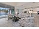 Bright, modern living area with views of the pool, featuring stylish seating and an open floor plan at 2319 Webber St, Sarasota, FL 34239