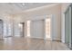 Open concept living area with built-in shelving, tile floors, and a view of the front yard at 2319 Webber St, Sarasota, FL 34239