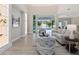 Bright living room featuring stylish furniture, modern decor, and a seamless transition to the outdoor pool area at 2319 Webber St, Sarasota, FL 34239