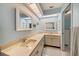 Bright bathroom with double sink and marine-themed decorations at 238 Lookout Point Dr, Osprey, FL 34229