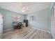 Bright bedroom with ceiling fan and laminate wood flooring at 238 Lookout Point Dr, Osprey, FL 34229