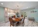 Dining room with wooden table set for meal with an easy transition to outdoor living at 238 Lookout Point Dr, Osprey, FL 34229