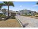 Paver driveway leading to a home with a two-car garage, landscaped yard, and modern architecture at 238 Lookout Point Dr, Osprey, FL 34229