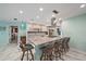 Spacious kitchen with island, seating, stainless appliances, and marble countertops is perfect for entertaining at 238 Lookout Point Dr, Osprey, FL 34229
