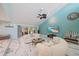 Bright living area with vaulted ceilings, comfortable seating, stylish decor, and access to an outdoor space at 238 Lookout Point Dr, Osprey, FL 34229
