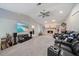 Relaxing living room with stone fireplace, recliner seating, and large screen TV at 238 Lookout Point Dr, Osprey, FL 34229