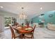The dining and living area connect seamlessly in this spacious home at 238 Lookout Point Dr, Osprey, FL 34229
