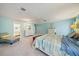 Inviting bedroom featuring blue walls and plush carpeting at 238 Lookout Point Dr, Osprey, FL 34229