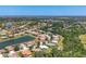 Aerial view showcasing the community layout, highlighting the blend of homes, greenery, and serene lake at 246 Petrel Trl, Bradenton, FL 34212