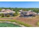 Backyard view featuring screened-in pools and landscaped properties, emphasizing outdoor living and privacy at 246 Petrel Trl, Bradenton, FL 34212