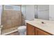 Bathroom with walk-in shower, neutral tile and a single sink vanity at 246 Petrel Trl, Bradenton, FL 34212
