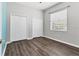 Bedroom with wood floors, window, and closet space at 246 Petrel Trl, Bradenton, FL 34212