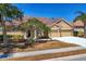 Charming one-story home with a red tile roof, well-manicured landscaping, and a two-car garage at 246 Petrel Trl, Bradenton, FL 34212