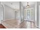 Welcoming foyer featuring tile flooring, elegant chandeliers, and views to formal living and dining spaces at 246 Petrel Trl, Bradenton, FL 34212