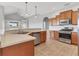 Bright kitchen features stainless steel appliances, tile flooring, and plenty of cabinet space at 246 Petrel Trl, Bradenton, FL 34212
