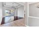 Spacious living room with wood floors, coffered ceilings, and sliding doors to the outdoor living space at 246 Petrel Trl, Bradenton, FL 34212