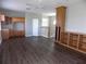 Open living area featuring built-in shelving, cabinets, and hardwood floors, perfect for entertaining and relaxation at 246 Petrel Trl, Bradenton, FL 34212