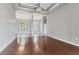 Spacious living room with wood floors, coffered ceilings, and views to the front entry at 246 Petrel Trl, Bradenton, FL 34212