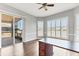 Office space with hardwood floors, plantation shutters, and a door to the outside at 246 Petrel Trl, Bradenton, FL 34212