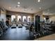 Well-equipped fitness center with treadmills, elliptical machines, weights, and mirrors for a complete workout at 2525 Vaccaro Dr, Sarasota, FL 34231