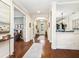 Elegant foyer with hardwood floors, arched doorways, and stylish decor; setting a welcoming tone at 2525 Vaccaro Dr, Sarasota, FL 34231