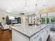 Open floor plan with great view from kitchen island into the living room and backyard at 2525 Vaccaro Dr, Sarasota, FL 34231