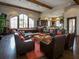 Inviting resident lounge with comfortable seating, a pool table, and a view into the modern kitchen at 2525 Vaccaro Dr, Sarasota, FL 34231