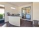Outdoor kitchen featuring a stainless steel grill, granite counters, and convenient access to the indoor kitchen at 2525 Vaccaro Dr, Sarasota, FL 34231