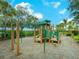 Community playground with slides, climbing structures and a playful design, perfect for children at 2525 Vaccaro Dr, Sarasota, FL 34231